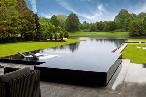 A stunning and unique swimming pool design will take your backyard oasis to the next level for entertaining.